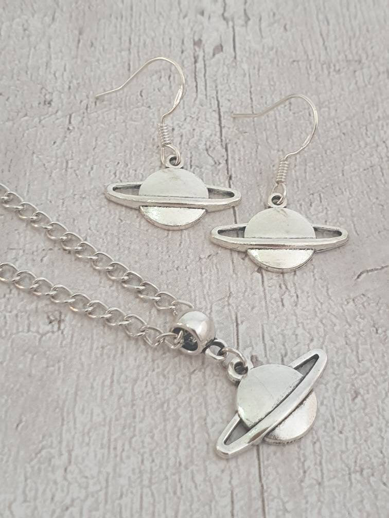 Handmade Antique Silver Saturn Charm Jewellery Set, Dangly Earring And Necklace Set In Gift Bag, Cord Or Chain Options - Premium  from Etsy - Just £8.99! Shop now at Uniquely Holt