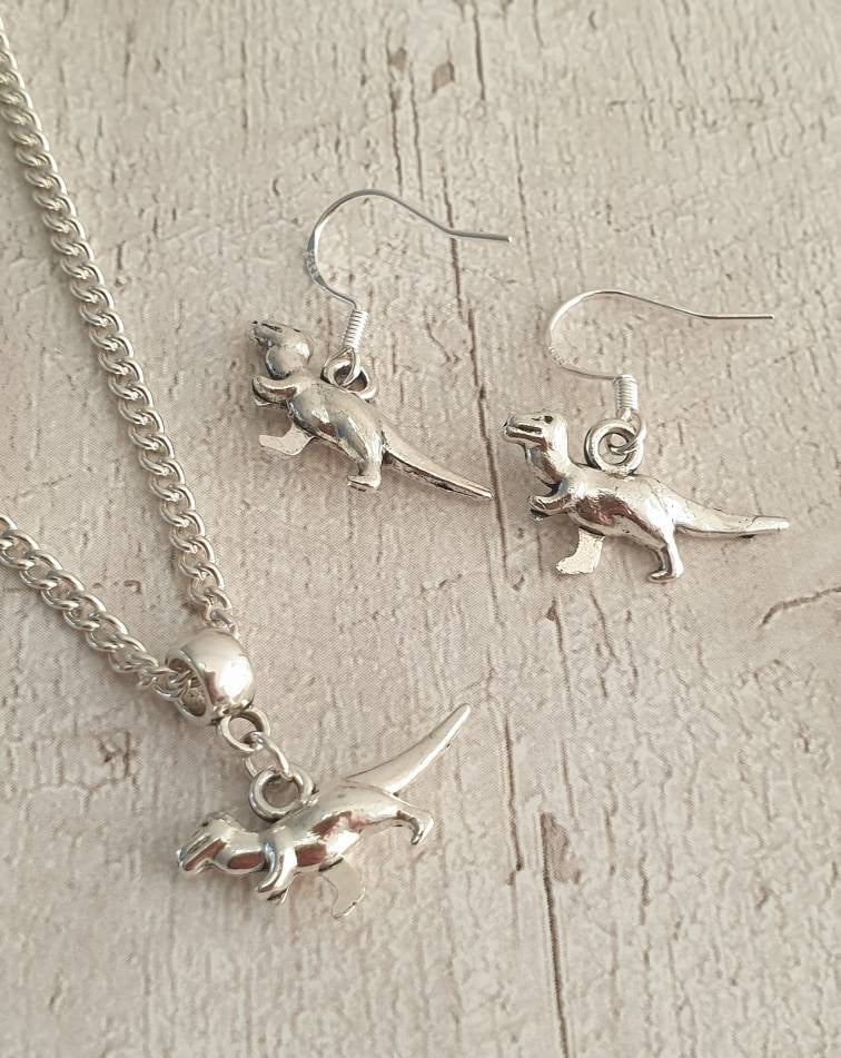 Handmade Antique Silver Dinosaur Charm Jewellery Set, Dangly Earring And Necklace Set In Gift Bag, Cord Or Chain Options - Premium  from Etsy - Just £8.99! Shop now at Uniquely Holt