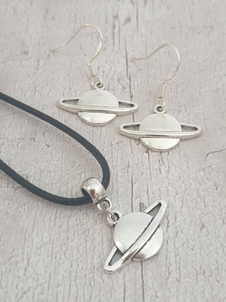 Handmade Antique Silver Saturn Charm Jewellery Set, Dangly Earring And Necklace Set In Gift Bag, Cord Or Chain Options - Premium  from Etsy - Just £8.99! Shop now at Uniquely Holt